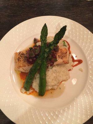 Salmon with a grape chutney over risotto with asparagus