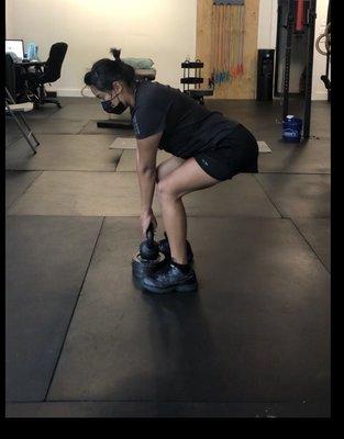 working on kettle bell deadlifts