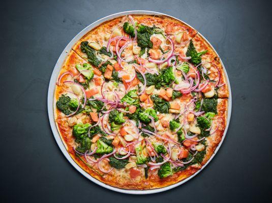 Marinara sauce and cheese, broccoli, fresh tomatoes, sweet red onions, roasted garlic and spinach.