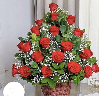 A basket with two dozen of roses available in different colors