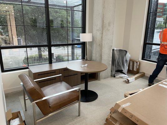 Round table with its chair and a credenza in the back