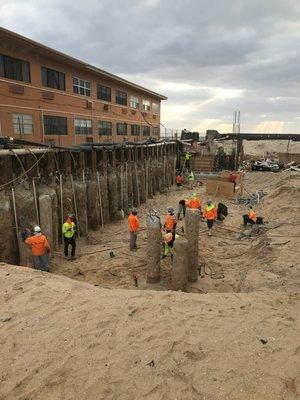 Suspended Wellpoint dewatering system installed by EXPERT DEWATERING INC, while not compromising neighboring structure.