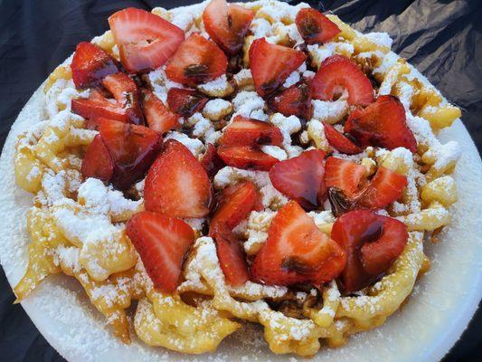 Strawberry funnel cake with added chocolate sauce