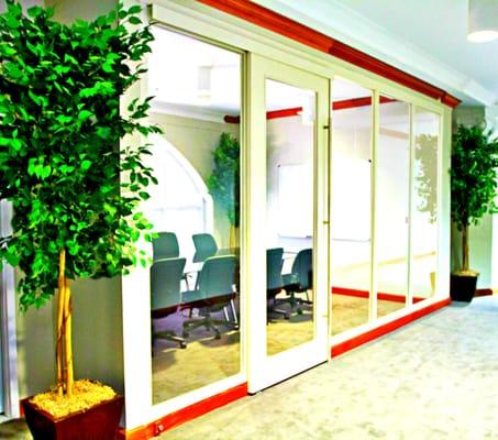 Glass-Paneled Conference Room with Sliding Door. Holds 8. 
 
 Schedule a Tour Today | 404.618.0789