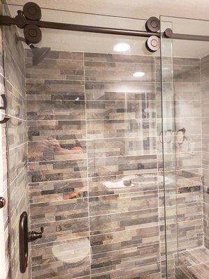 Barn door shower glass