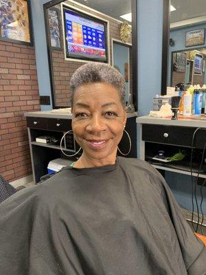 Me in my barber-G's chair after my haircut.