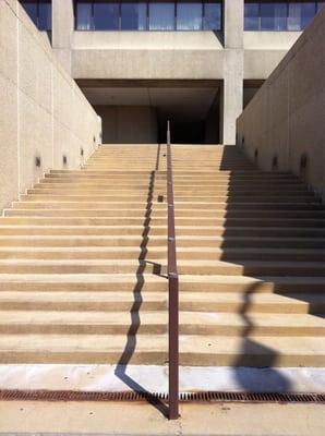 Windy entrance right next to a lite rail line and practically under the expressway