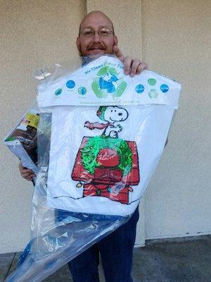 My hubbs carrying the items we got dry cleaned in his left arm is a wool blanket