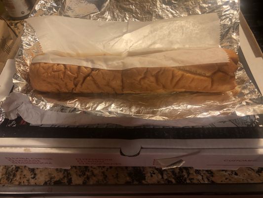 Cheesesteak reveal.... FYI ( I have it sitting on top of our pizza box to show the size)