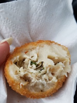 Savory chicken and cheese inside the coxinha.