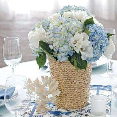 Nautical piece with blue & white hydrangeas and white roses in a hemp wrapped jar.  Simple beauty!