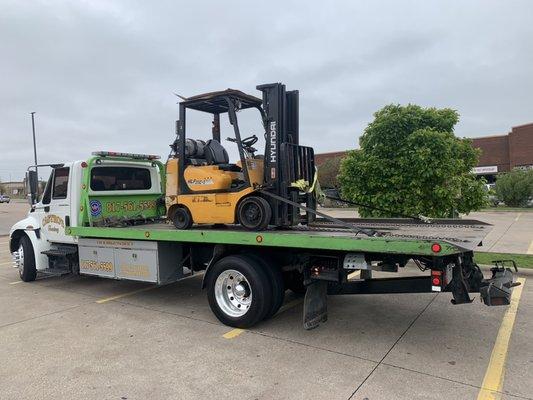 Transporting a forklift! Call us any day 24/7 for any of your towing or transporting needs!