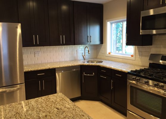 New cabinets, appliances, countertops, backsplash