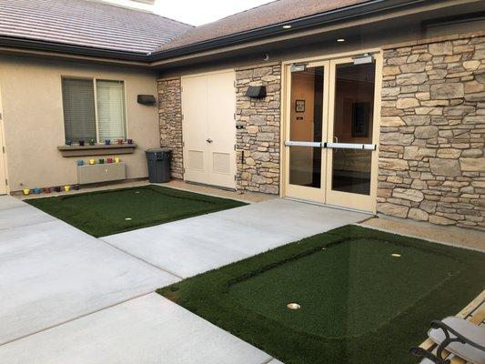 One of two outdoor spaces, with Putting green!