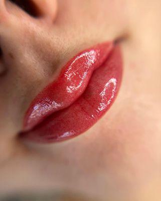 Lip blushing: a semi-permanent cosmetic tattoo enhancing lip color, definition, and symmetry for a natural, refreshed pout.