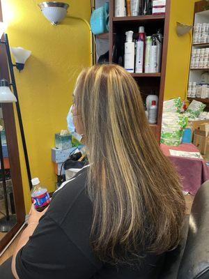 Highlights and color with long layered haircut