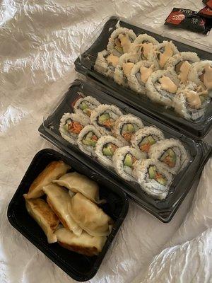 Dumplings, vegetable roll, spicy roll with salmon