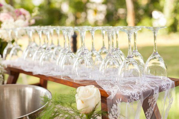 Rustic Bench Riser with lace and glassware