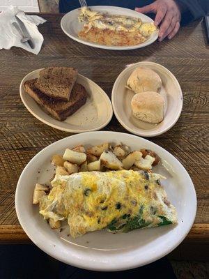 Custom omelettes, biscuit, raisin bread