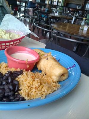 Seafood chimichanga with rice and beans, special sauce on the side