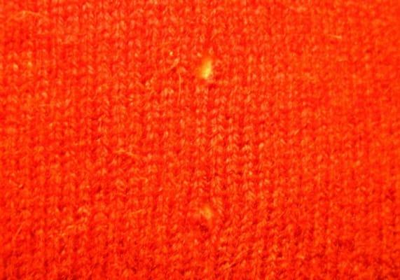 2 moth holes in sweater