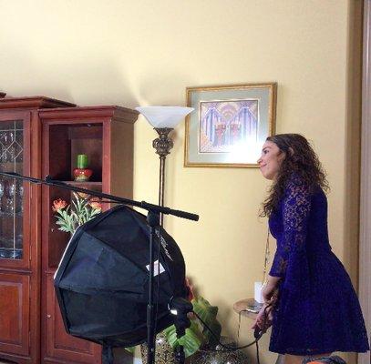 Cindy adjusting lights on set....ACTION!