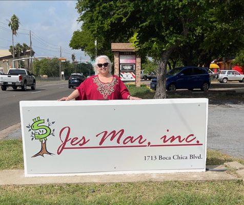 President with outside sign