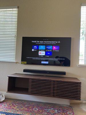 LG Tv installed with Lg Sound bar 

We also installed the floating cabinet