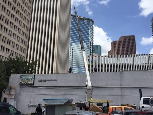 Replacing a 10 ton rooftop AC unit at Young Scholars Academy.