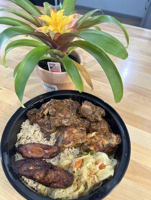 Jerk chicken marinated for 24 hours in our homemade jerk seasoning than smoked 
served with rice gungo peas, cabbage, and plantains!