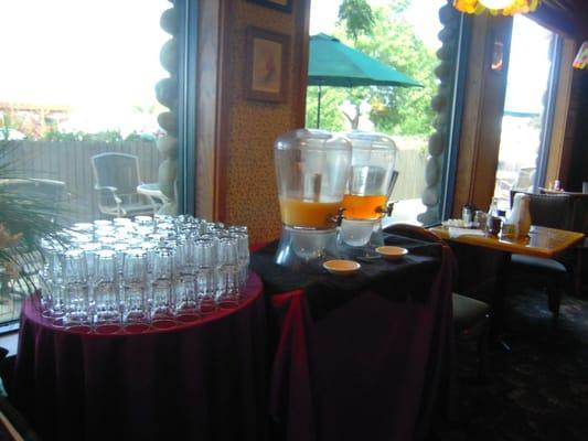 fresh orange juice and tea at breakfast buffet