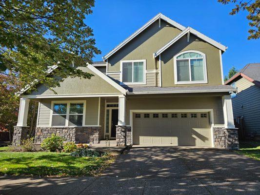 Newly repainted Bunglehouse Gray exterior with trim repairs completed around the property!