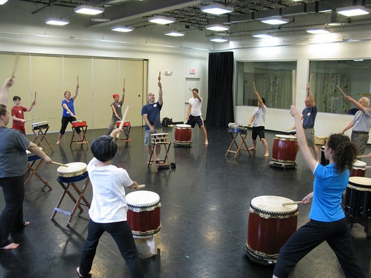 Mark H. Rooney leads an intro to Taiko Drumming class in Studio 1.