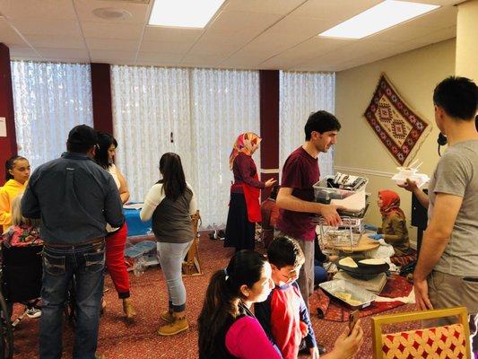 Rain Drop Turkish House:  Food Area; Women on floor making bread