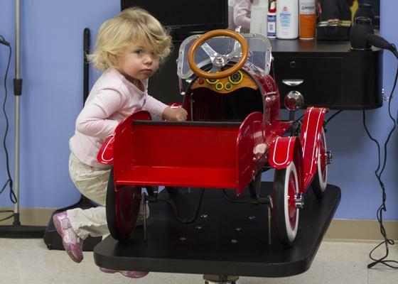 Looks like someone is excited for her turn in the fire truck.