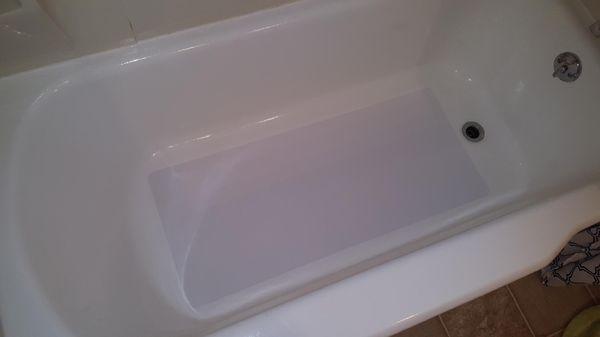 Reglazed bathtub with a non-skid safety mat installed.