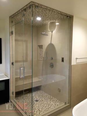 Custom designed Frameless steam shower enclosure made with 1/2" Starphire glass protected by Enduroshield