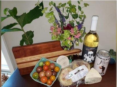 Wine, cheese, heirloom tomatoes, handmade cutting board - what a great house warming gift from the farmer's market!