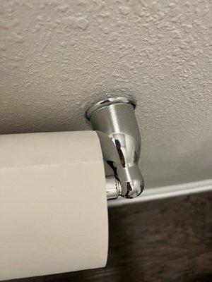 The hardly attached toilet paper holder