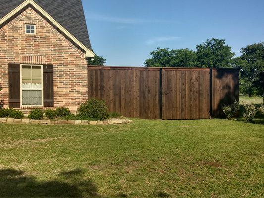 Board on board fence and gate.