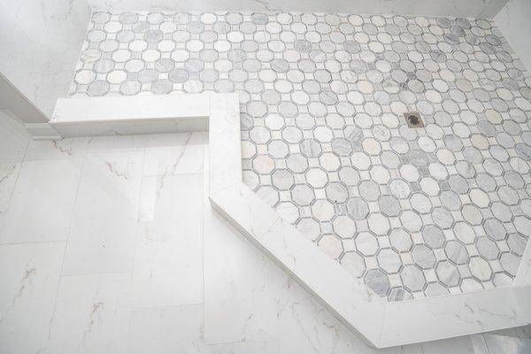 Bathroom remodel with porcelain tile and marble mosaic.