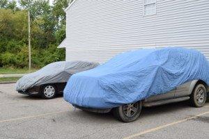 THIS IS WHAT A NEW MILLENNIUM DID NOT DO...COVERED THE CARS TO PREVENT DAMAGE