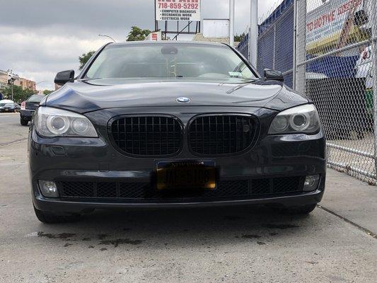 Front bumper repaired and painted. Grill painted gloss black.