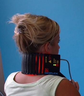 A patient receiving treatment for her neck pain with our Meditech BioFlex low-intensity "cold" laser therapy system.