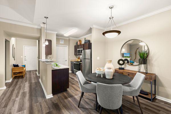 Kitchen with stainless steel appliances and dining room at Estancia at Ridgeview Ranch