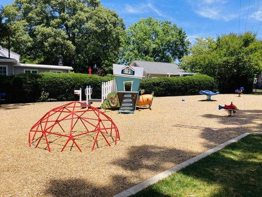 Playground for toddlers, fenced in too.