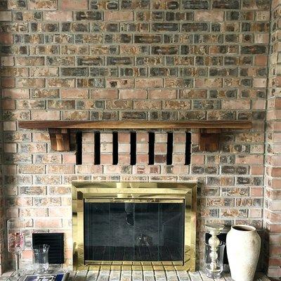 A mantel with corbels added (by request from client) for looks. The wood is 2" thick Walnut.