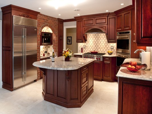 Cherry Kitchen with stainless umbrella hood and corner oven