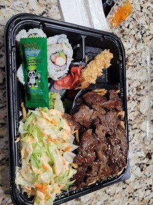 Beef Teriyaki bento box with 1 shrimp tempura, 4 California roll pieces and salad side (not seaweed salad)