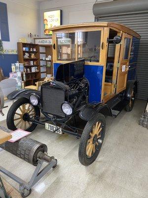 There is a car in the store! Neat!